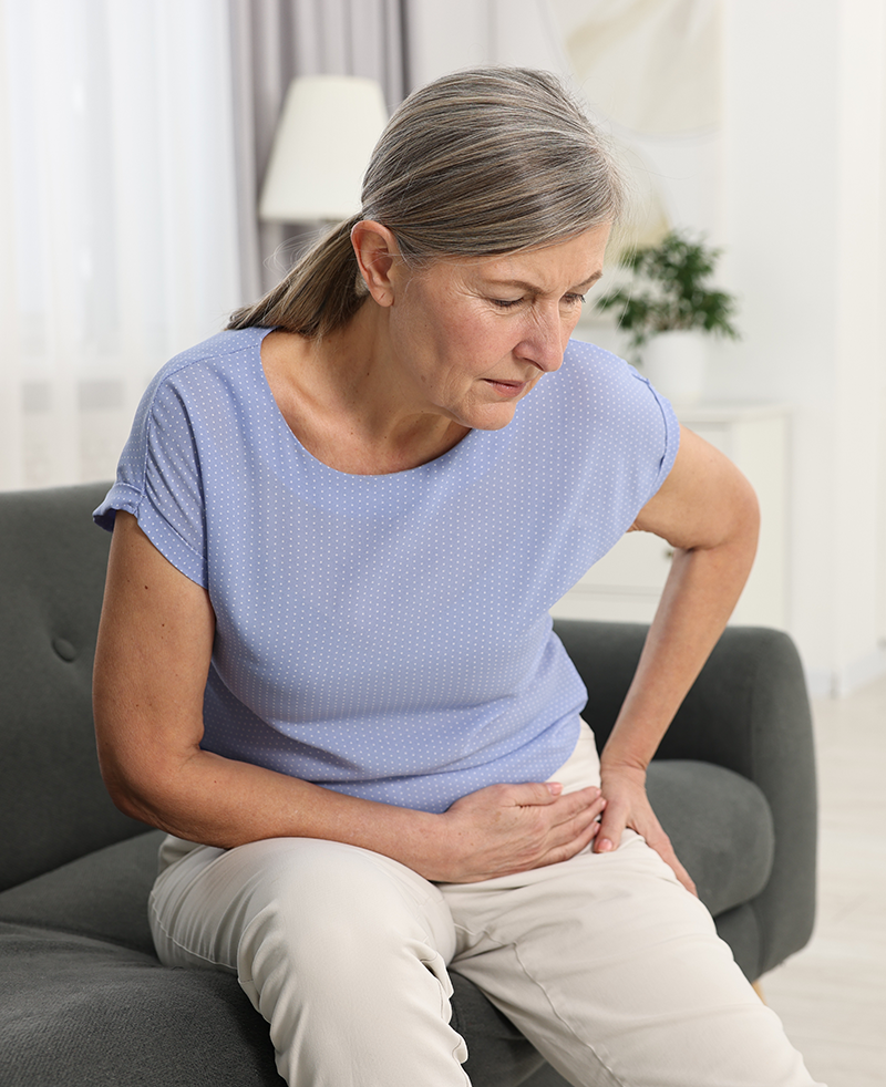 Woman with Arthritis on sofa